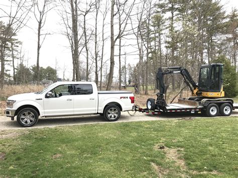 towing a mini excavator license|trucks for towing mini ex.